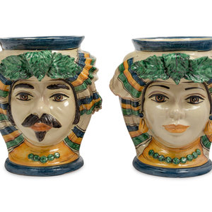 Appraisal: A Pair of Italian Polychrome Glazed Pottery Figural Vases Matteo