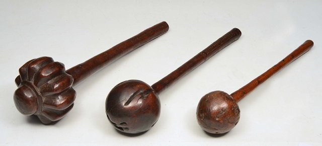 Appraisal: A FIJIAN HARDWOOD CLUB with rounded end the shaft decorated