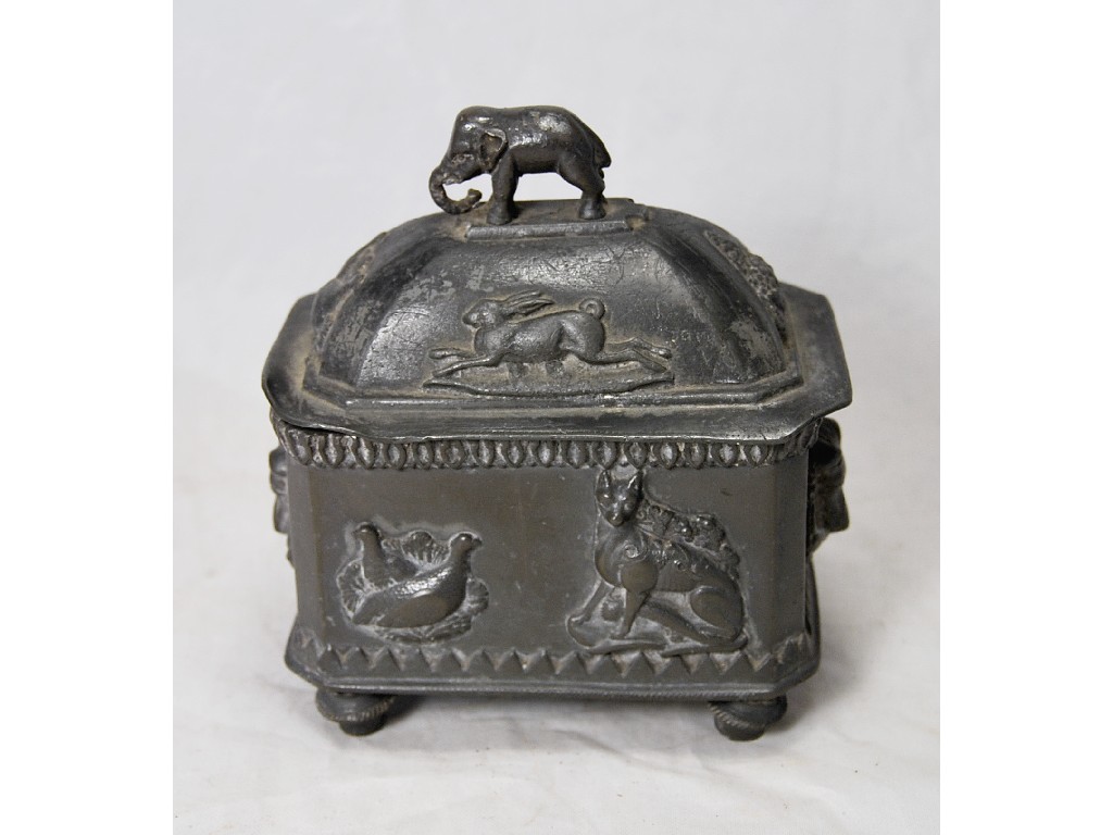 Appraisal: An antique pewter tobacco casket and cover with elephant finial