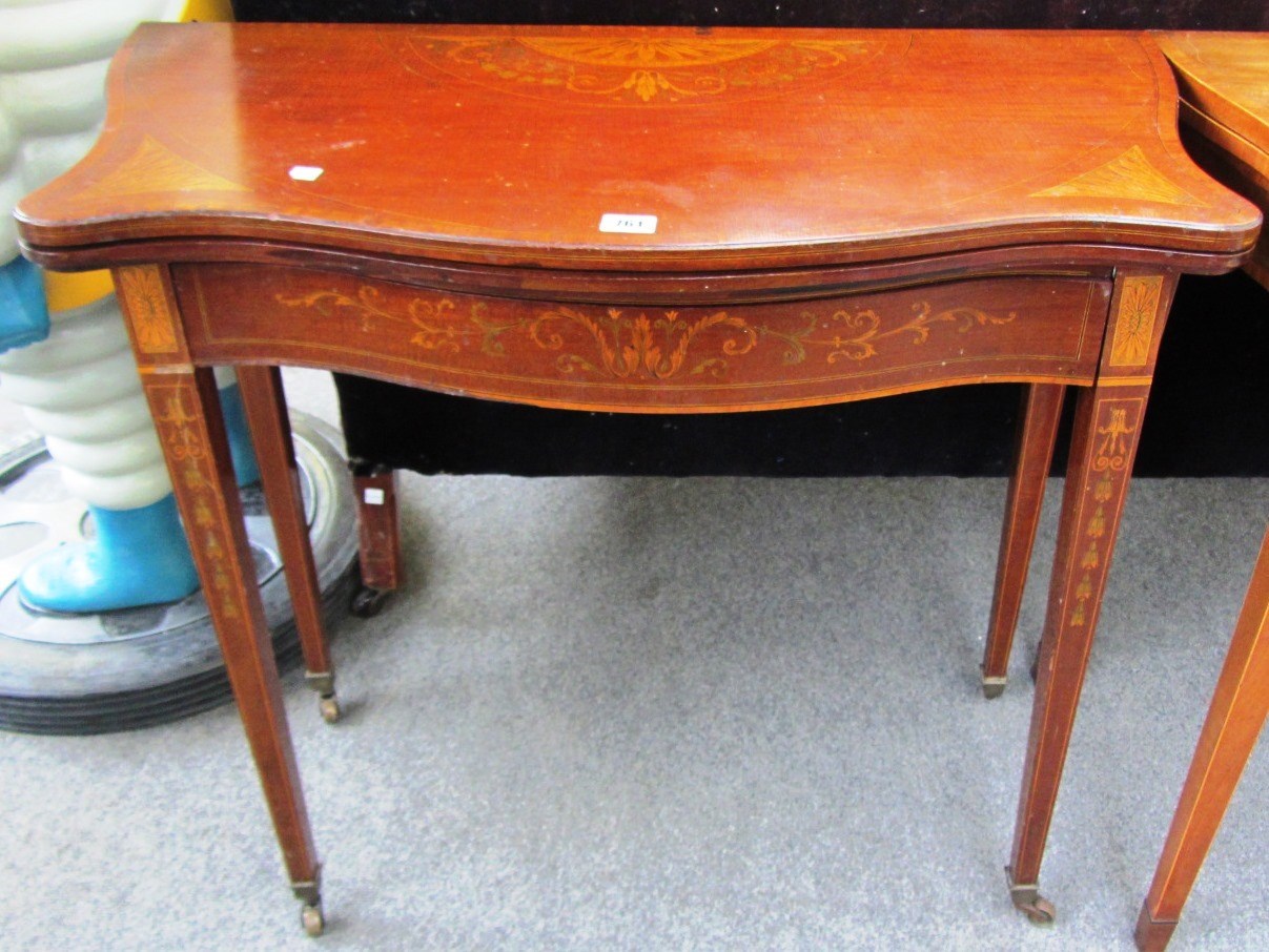 Appraisal: An Edwardian marquetry inlaid serpentine mahogany card table cm wide