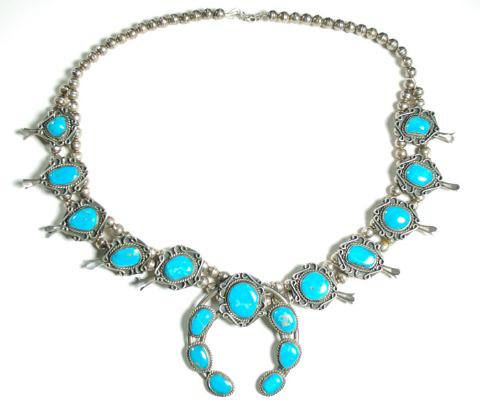 Appraisal: NAVAJO SILVER AND TURQUOISE SQUASH BLOSSOM NECKLACE Seventeen natural turquoise