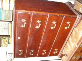 Appraisal: A stained pine chest of drawers with graduated drawers raised