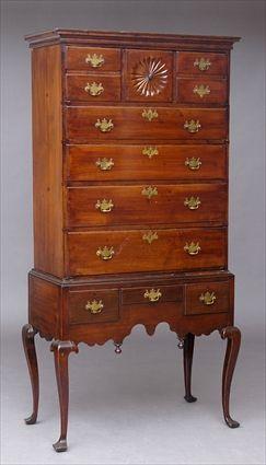 Appraisal: NEW ENGLAND CHERRY HIGHBOY The flat top cornice above a