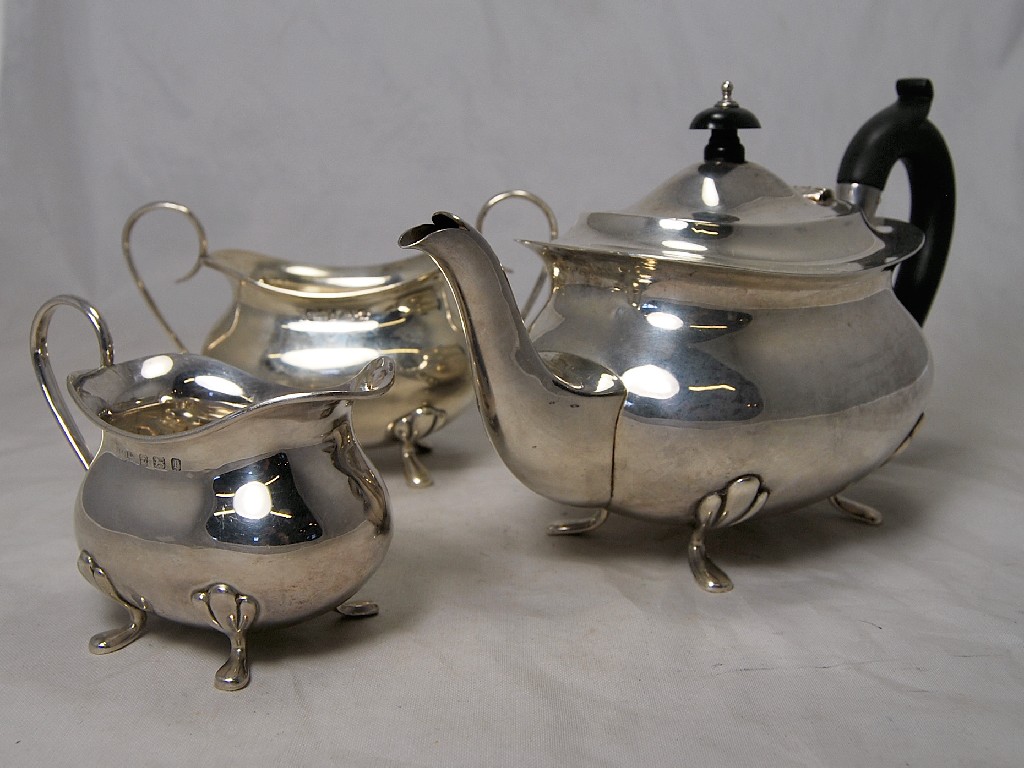 Appraisal: Rectangular three piece tea service with xylo handles approx oz