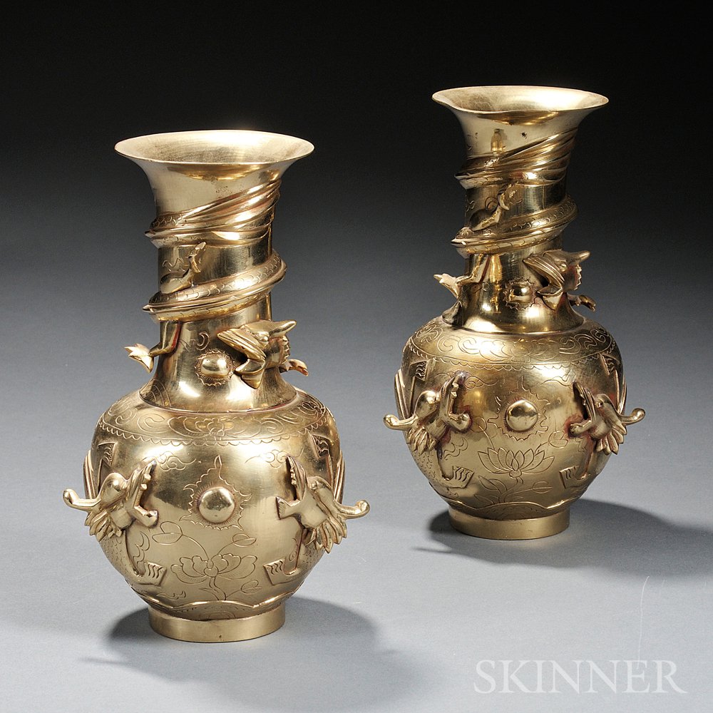 Appraisal: Two Cast Brass Vases China each bulbous with a long