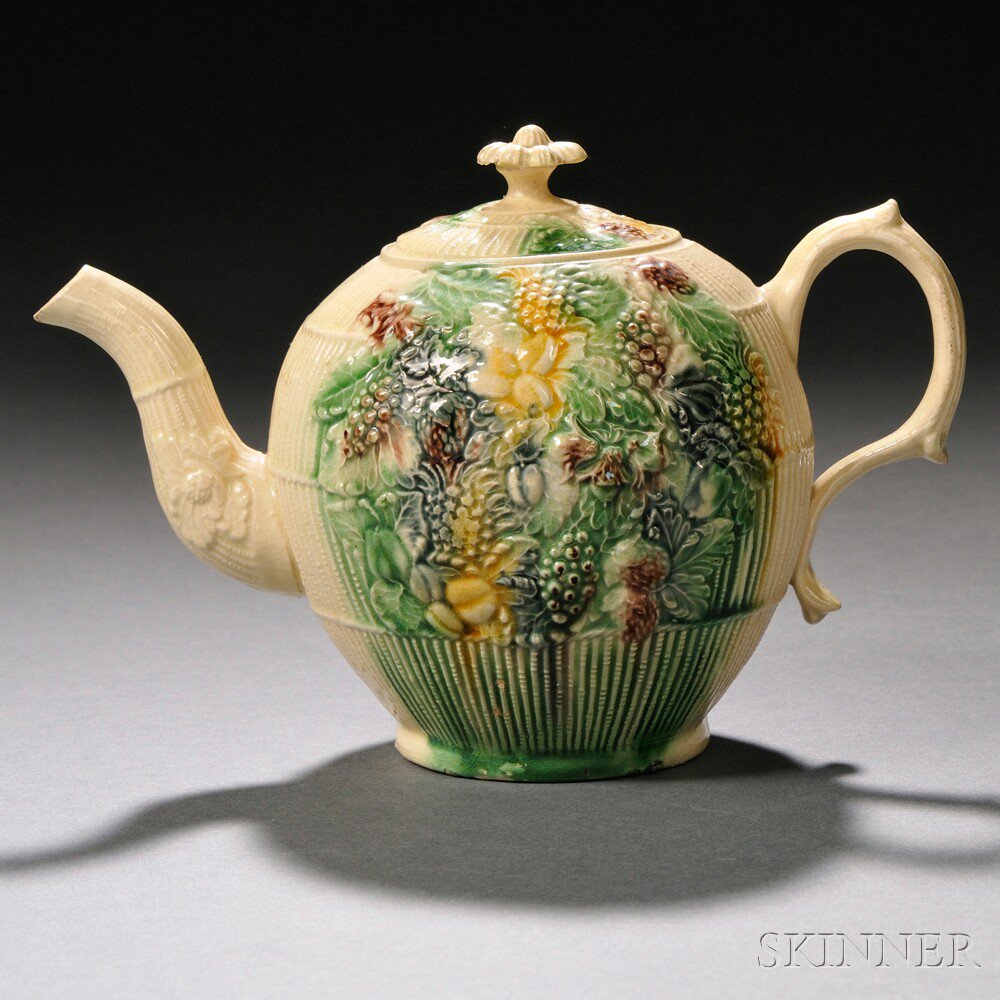 Appraisal: Staffordshire Cream-colored Earthenware Teapot and Cover England c globular with