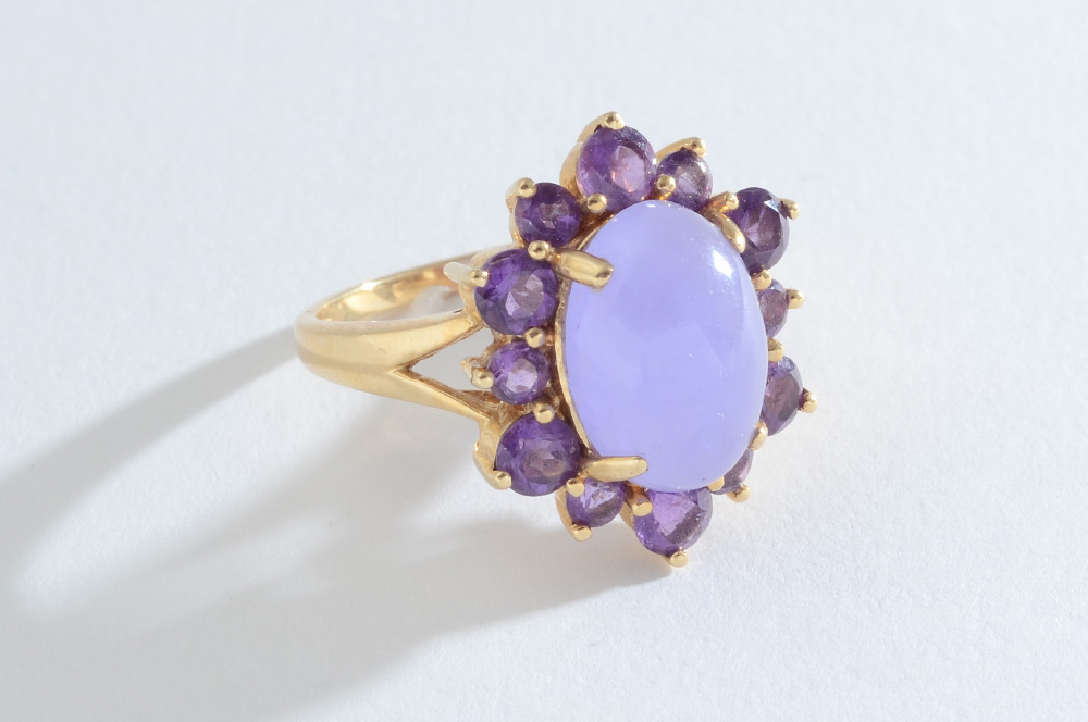 Appraisal: LAVENDER JADE AMETHYST RING K yellow gold ring centers an