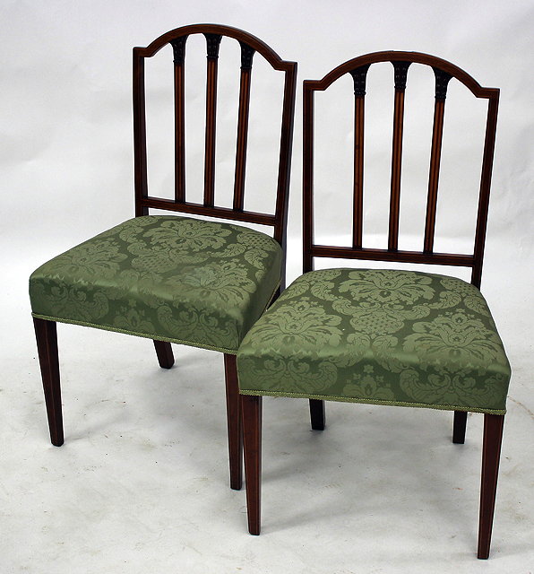 Appraisal: A PAIR OF SHERITON STYLE MAHOGANY STANDARD CHAIRS with upholstered