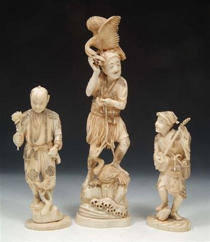 Appraisal: A JAPANESE CARVED IVORY MODEL of a fisherman with two