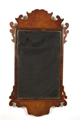 Appraisal: A mid th century walnut fret-frame wall mirror the replaced