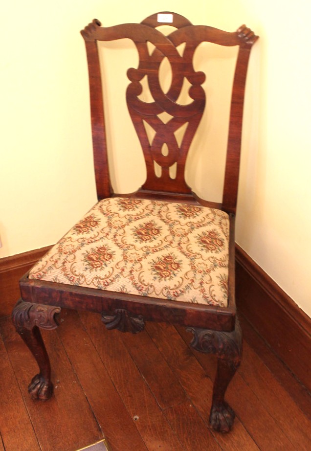 Appraisal: A George II walnut dining chair with scrolled cresting rail