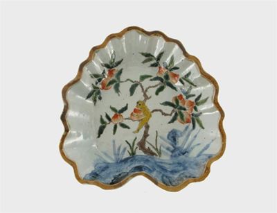 Appraisal: A Chinese dish decorated with a small hairy yellow monkey