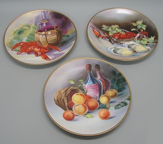 Appraisal: Grouping of three plates featuring lobster crab oysters and fruit