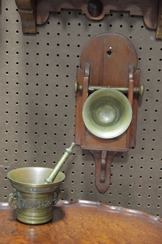 Appraisal: TWO MORTARS AND PESTLES Both brass one has embossed decoration