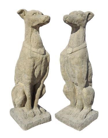 Appraisal: pair Cast stone garden statuary seated dogs each forward facing