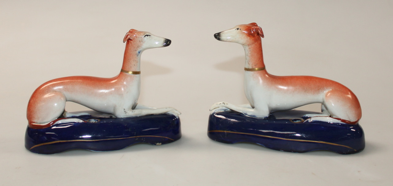 Appraisal: A pair of Staffordshire pottery greyhound ink stands each polychrome