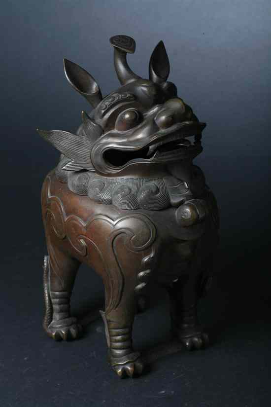 Appraisal: CHINESE BRONZE QILIN CENSER Qing Dynasty - in high