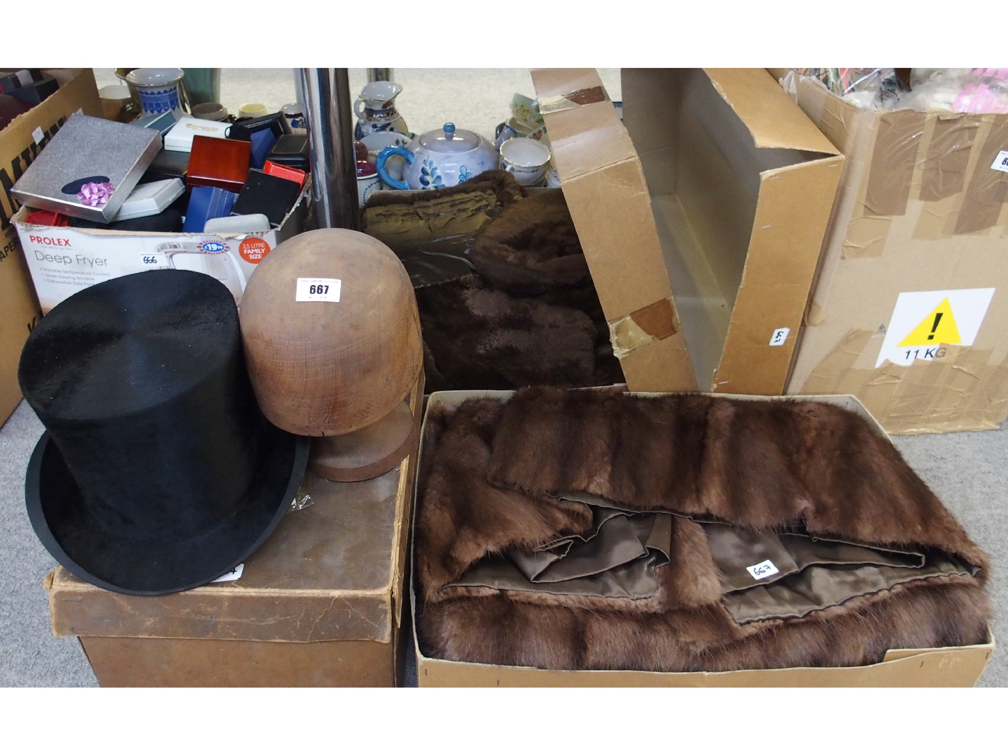 Appraisal: Wooden hat last top hat and fur jackets