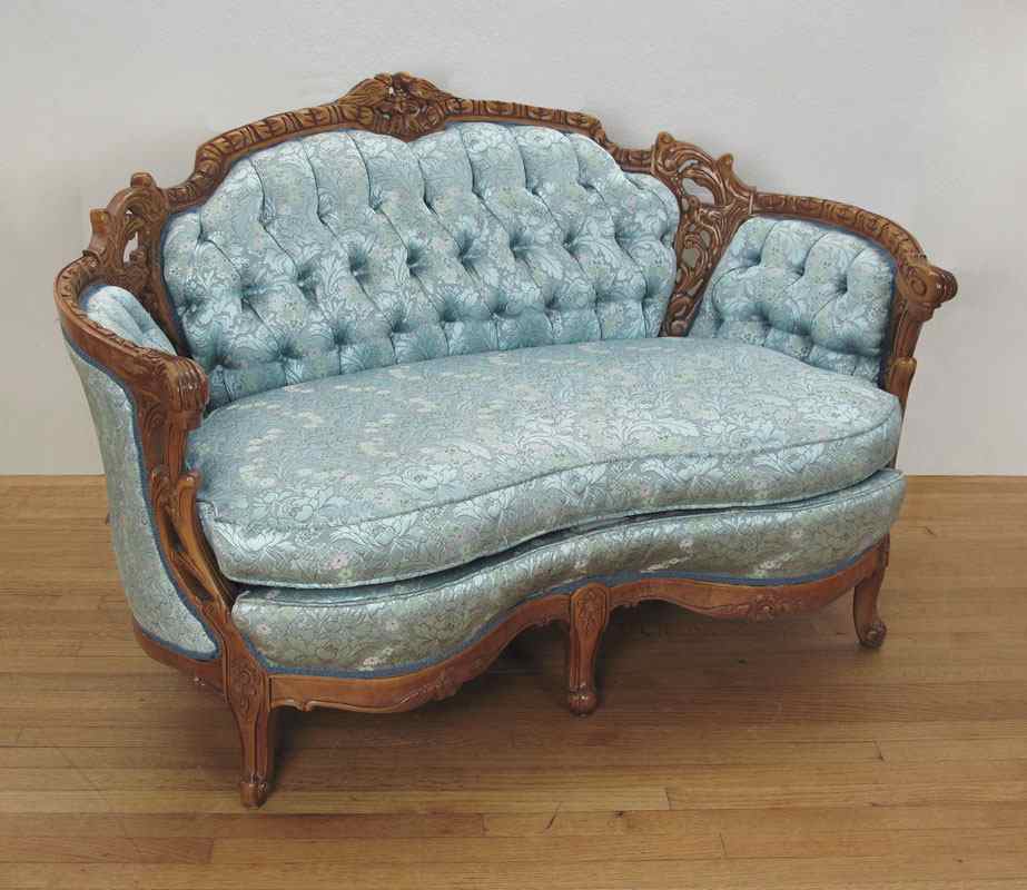 Appraisal: DEUTCH BROTHERS CARVED SETTEE Profusely carved with figural birds shaped