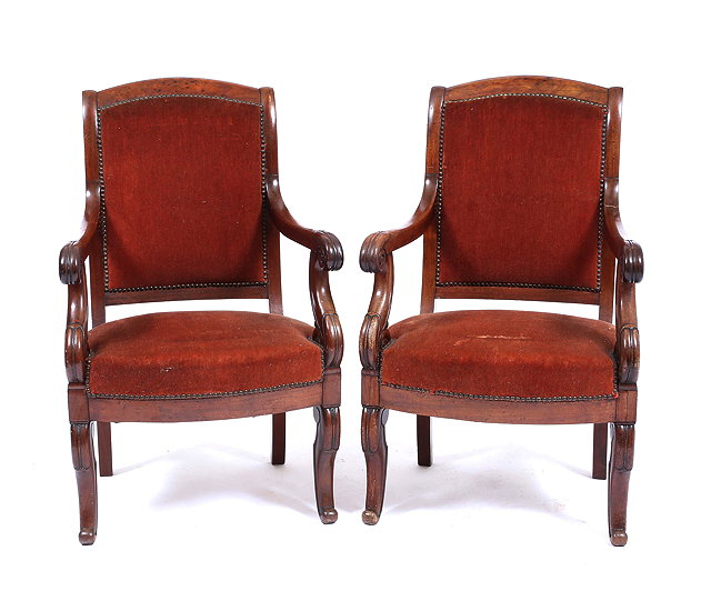 Appraisal: A PAIR OF TH CENTURY FRENCH WALNUT FRAMED ARMCHAIRS with