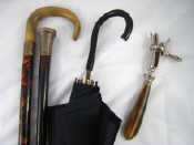 Appraisal: A mixed lot A horn handled hambone holder a cane