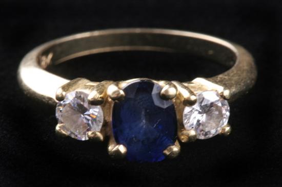 Appraisal: K YELLOW GOLD AND SAPPHIRE AND DIAMOND RING Oval ct