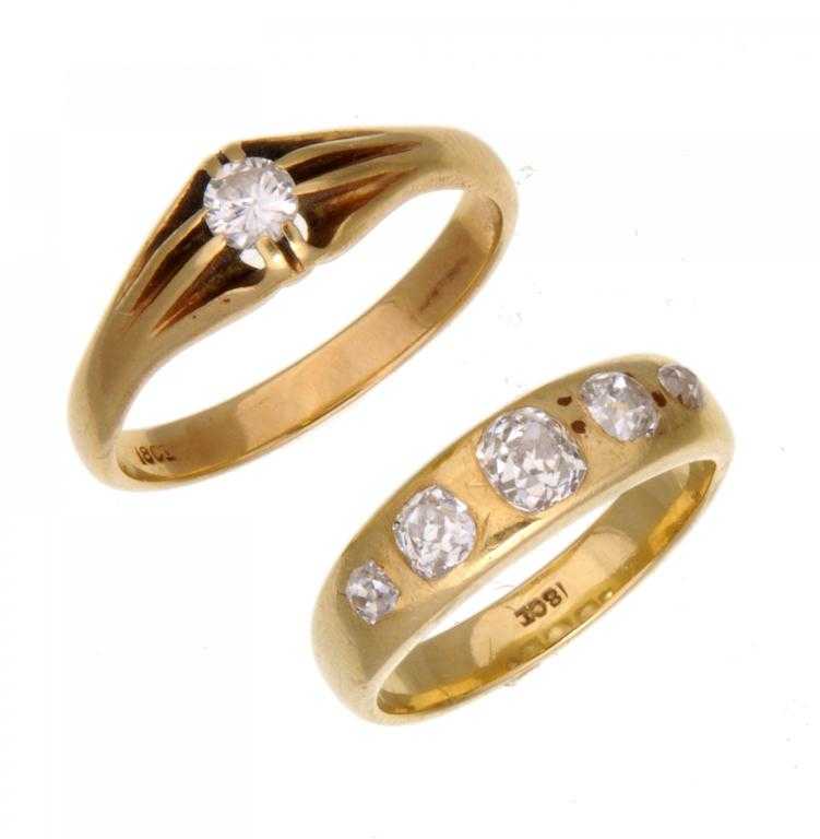 Appraisal: A DIAMOND FIVE-STONE RING AND A DIAMOND SOLITAIRE RING the