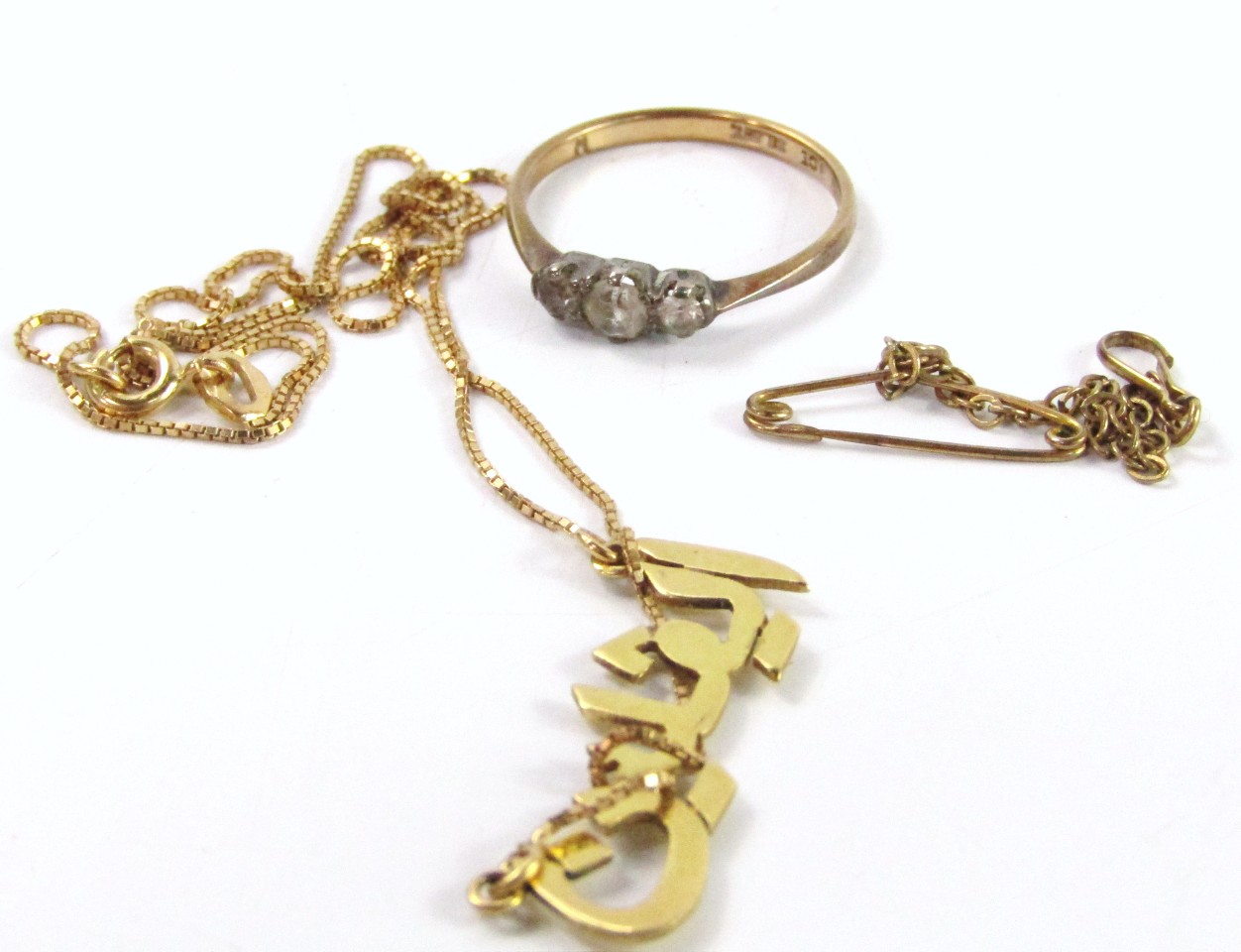 Appraisal: A yellow metal Arabic script pendant on chain clasp stamped