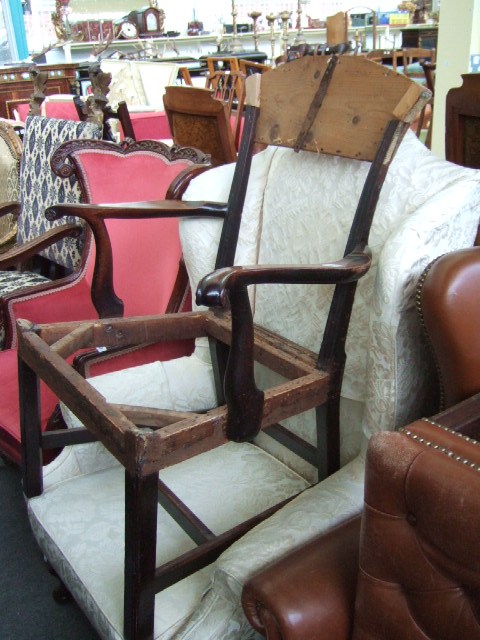 Appraisal: A George III mahogany armchair raised on square supports lacking