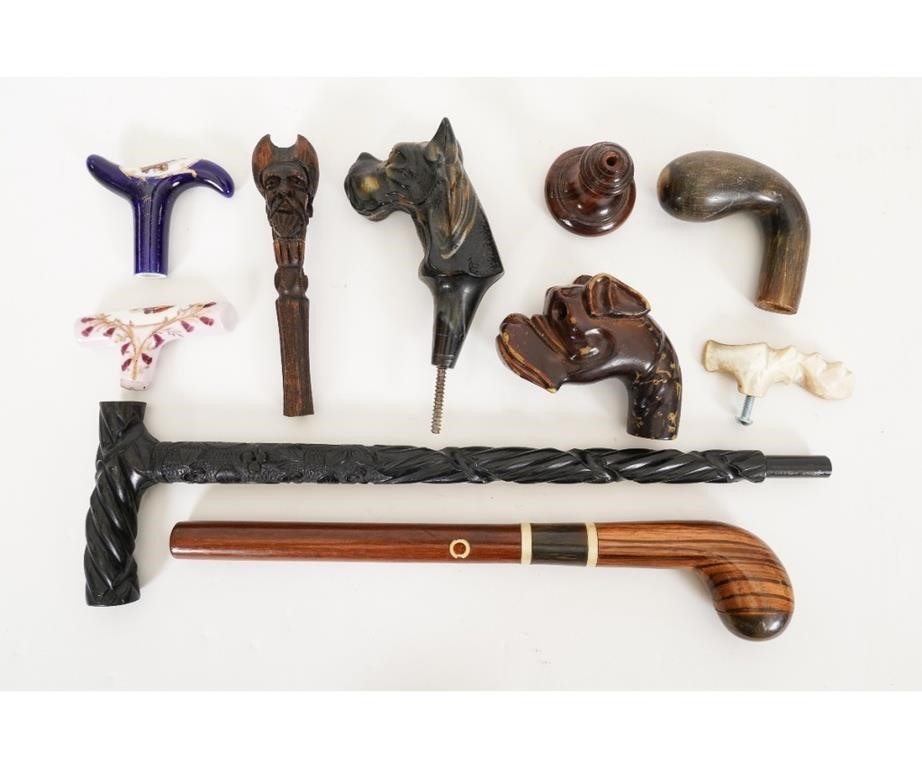 Appraisal: Collection of cane parts to include various carved animal grips