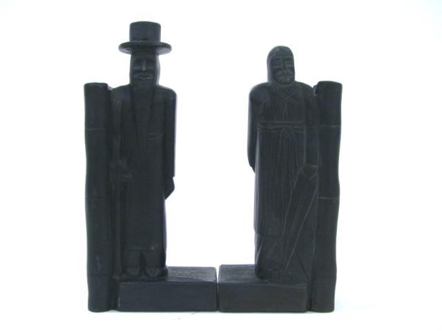 Appraisal: A Pair of Argillite Bookends Depicting a bearded Man a