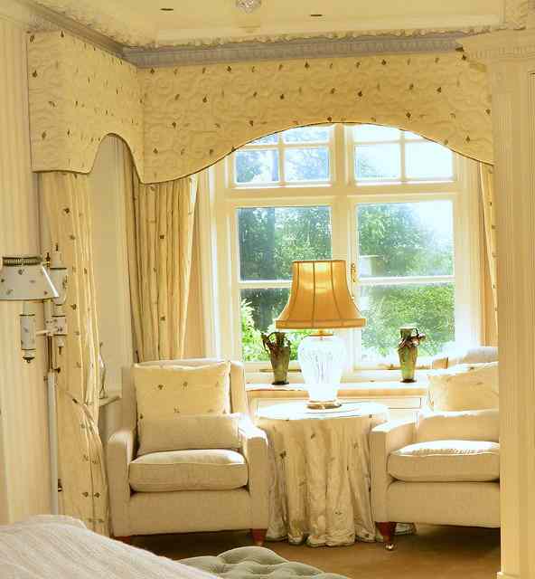 Appraisal: A CREAM SILK and leaf and acorn decorated curtains and