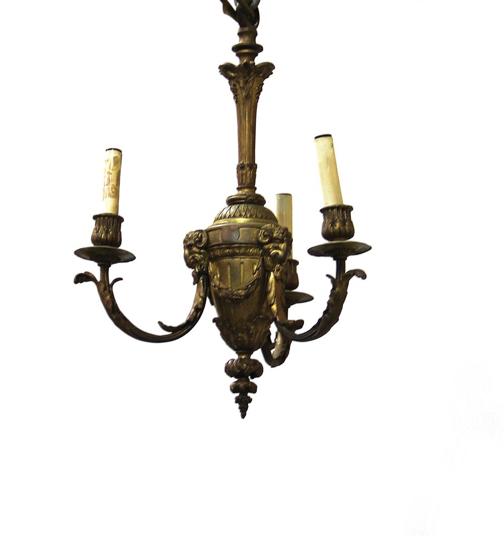 Appraisal: French gilt-bronze three-light chandelier early th century urn with ram's-head