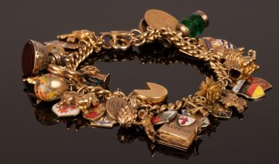 Appraisal: An ct gold curb link charm bracelet hung with a