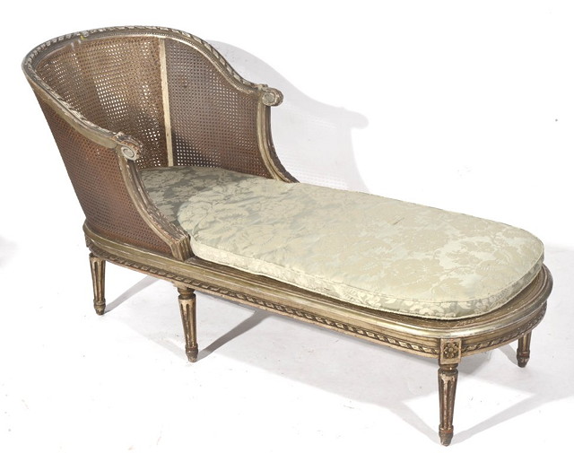 Appraisal: A FRENCH STYLE SILVER PAINTED DAY BED with cane back