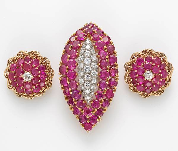 Appraisal: A ruby and diamond brooch-pendant and clip-earrings estimated total diamond