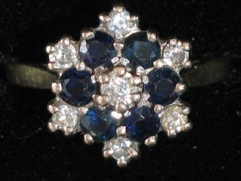 Appraisal: A DIAMOND AND SAPPHIRE DRESS RING set round-cut sapphires and