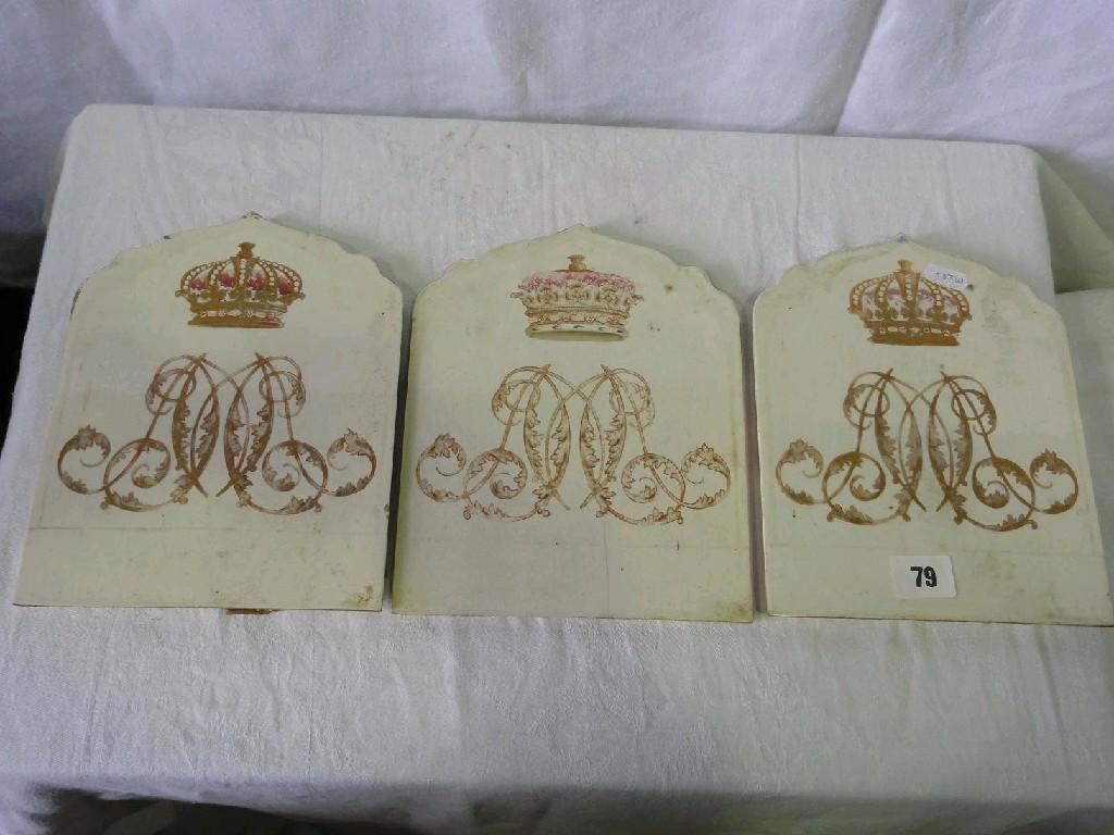 Appraisal: A set of three th century cream glazed tiles with