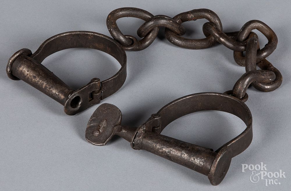 Appraisal: Wrought iron shackles th c Wrought iron shackles th c