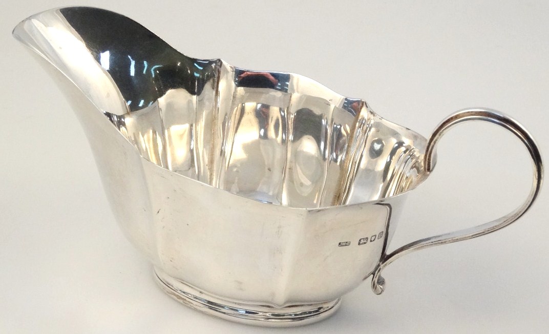 Appraisal: A George VI silver sauce boat by Josiah Williams Co