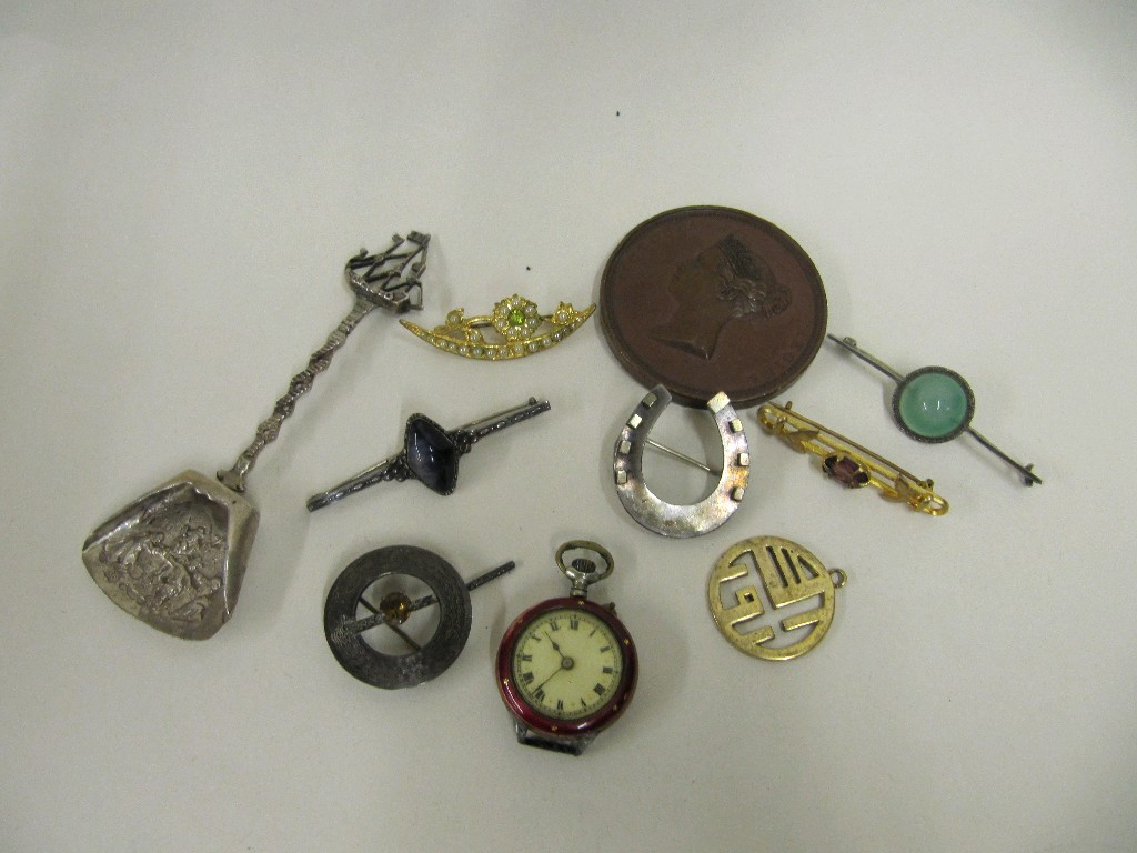 Appraisal: Lot comprising a Victorian bronze medallion silver brooches silver spoon