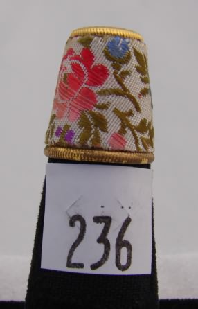 Appraisal: Floral embroidered gold tone thimble