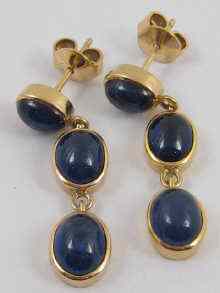 Appraisal: A pair of cabochon sapphire earrings set in yellow metal