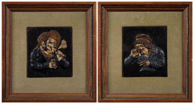 Appraisal: Pair iron figural plaques depicting smokers one a man wearing