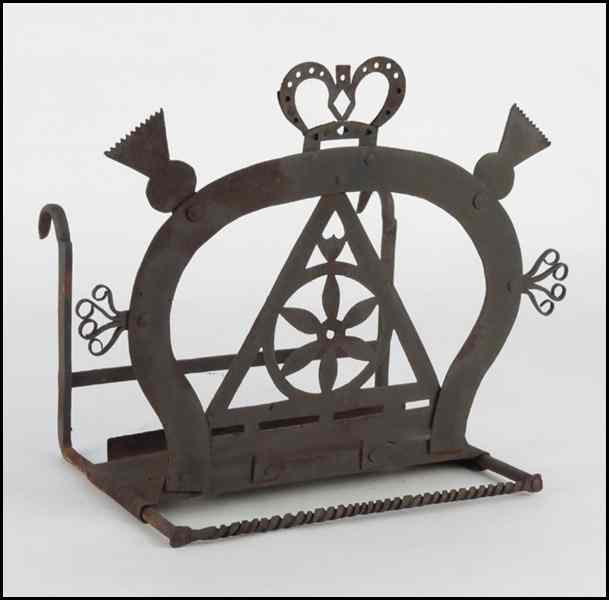 Appraisal: TH TH CENTURY SCOTTISH IRON TOASTER Bearing thistle and crown