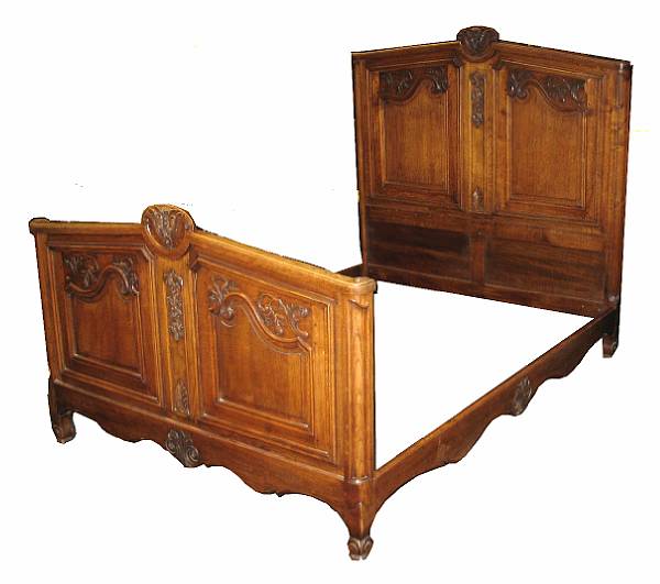 Appraisal: A Louis XV style carved oak bed comprising a headboard