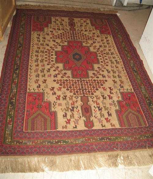 Appraisal: SOUMAK old Beige central field with a red central medallion