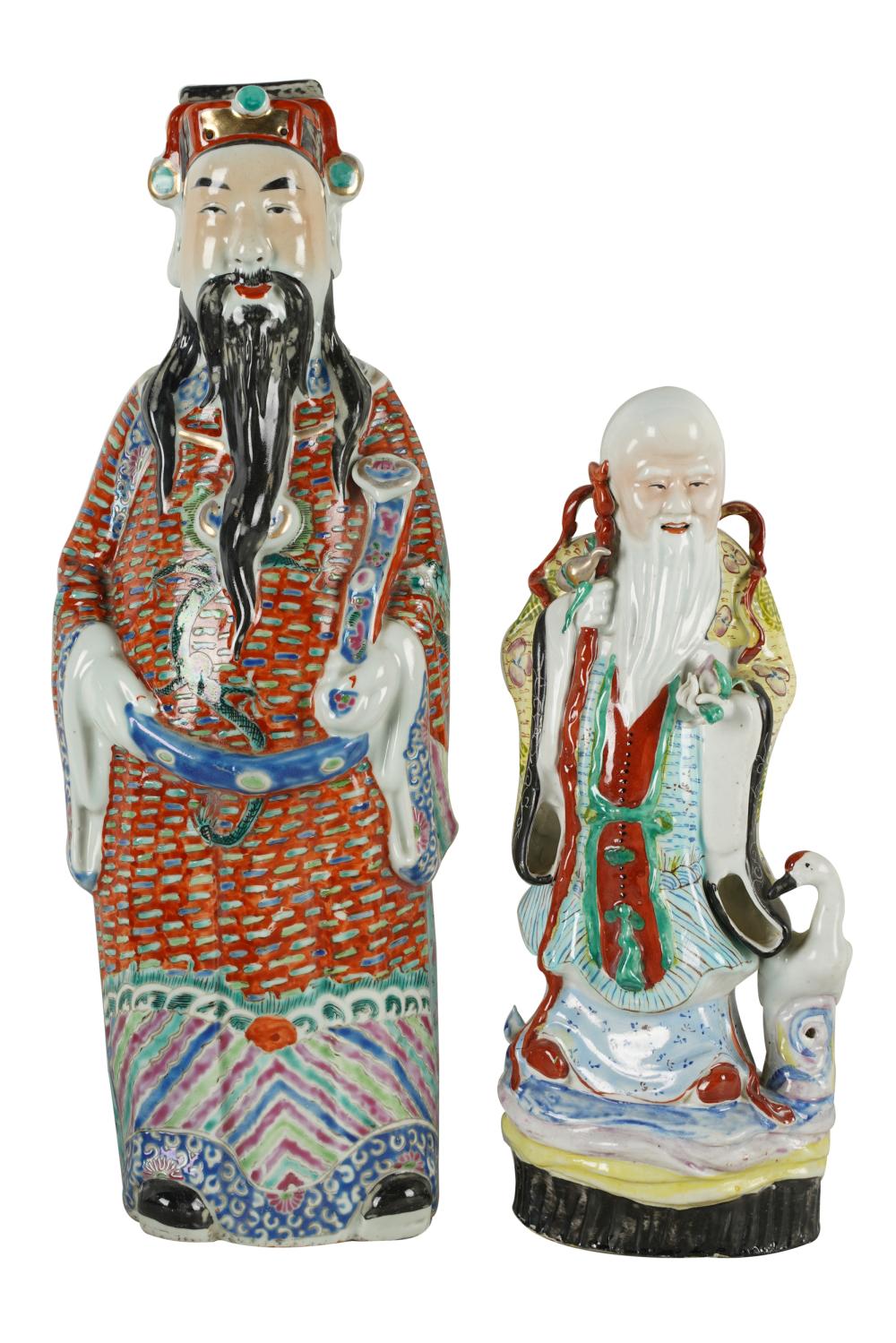 Appraisal: TWO CHINESE PORCELAIN FIGURES OF IMMORTALSgraduated larger figure with hole