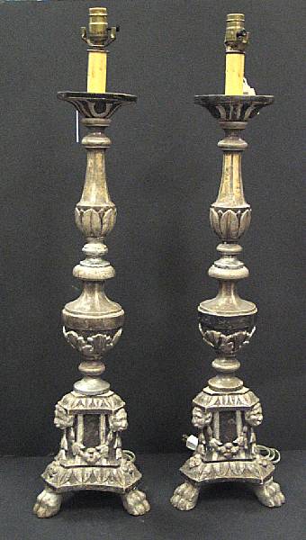 Appraisal: A set of four Neoclassical silvered wood candle prickets th