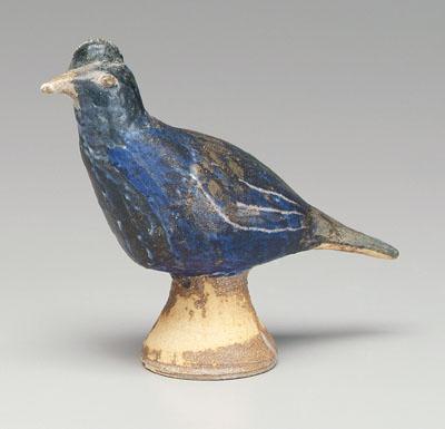 Appraisal: Arie Meaders bird comb and blue feathers mounted on tapering